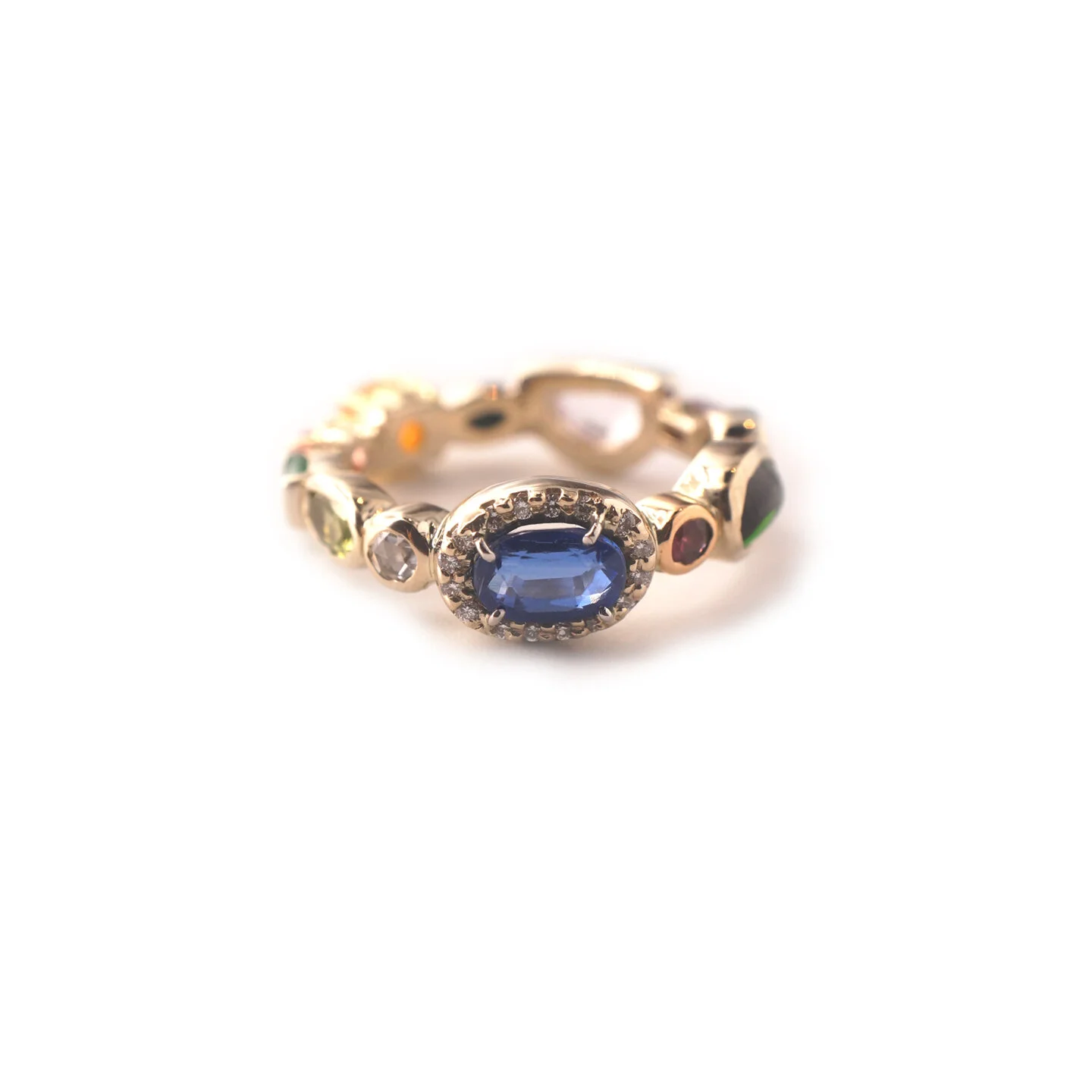  Baby Ring 17   $13,200.00      An eighteen-karat white, yellow and rose gold ring, set with a collection of gemstones and diamonds that reside together in harmony, respectful of their neighbors and of the ring as a whole.     Size 6   This piece, in