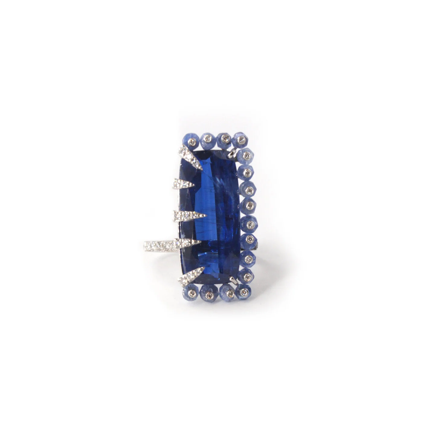  Passong Ring   $20,800.00     A statement ring featuring a magnificent thirteen carat Nepalese kyanite.  The vivid blue gemstone is surrounded on three sides by blue sapphire beads set with white diamonds, and on the other with five white diamond en