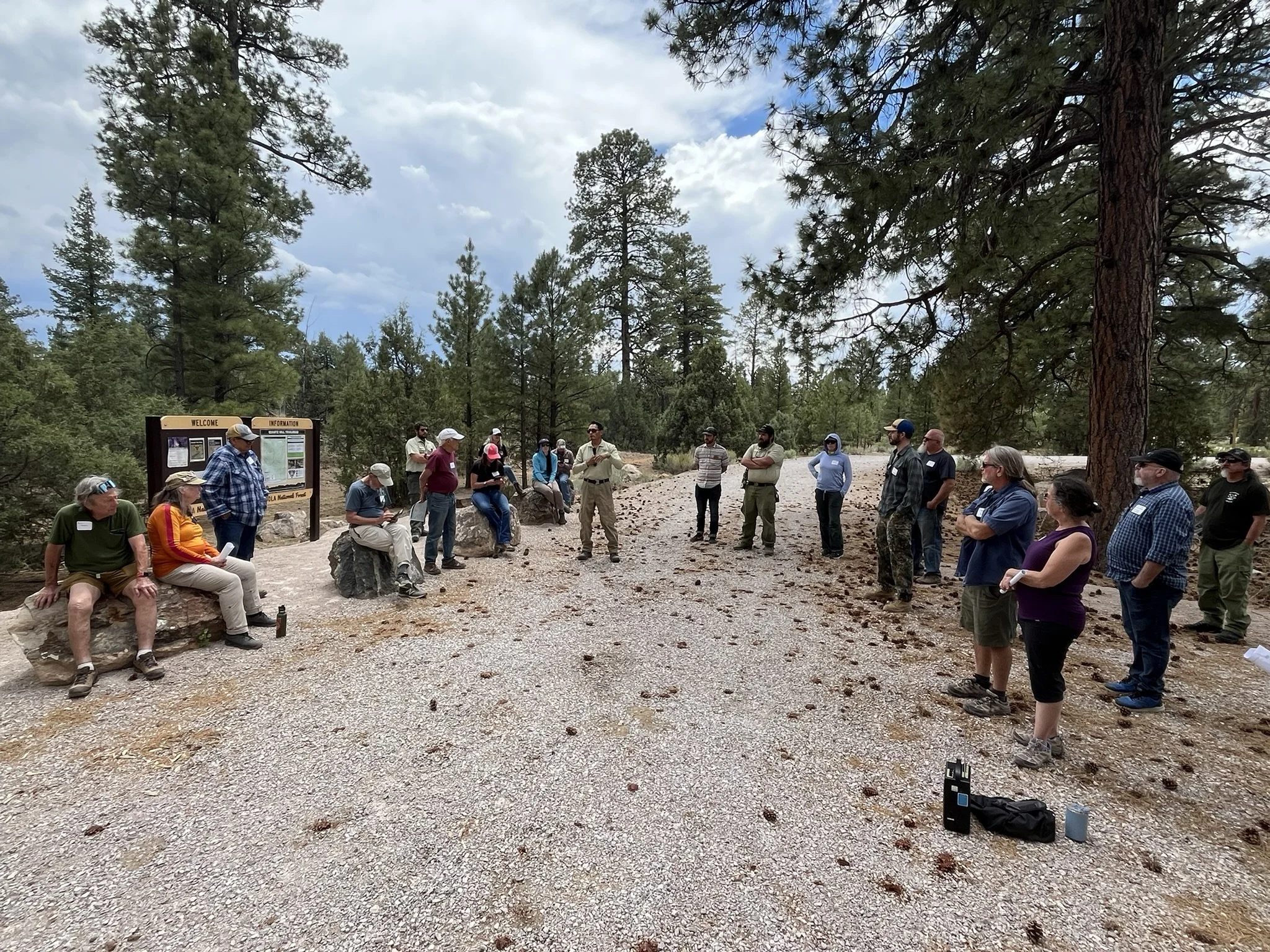  Arnold Wilson, US Forest Service - Mt. Taylor Ranger District, welcomes the group to the Quartz Hill trailhead and talks about the positive impacts of recreation. 