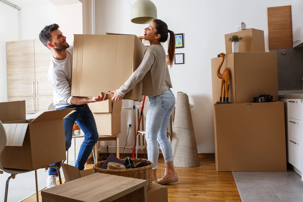 couple moving large boxes