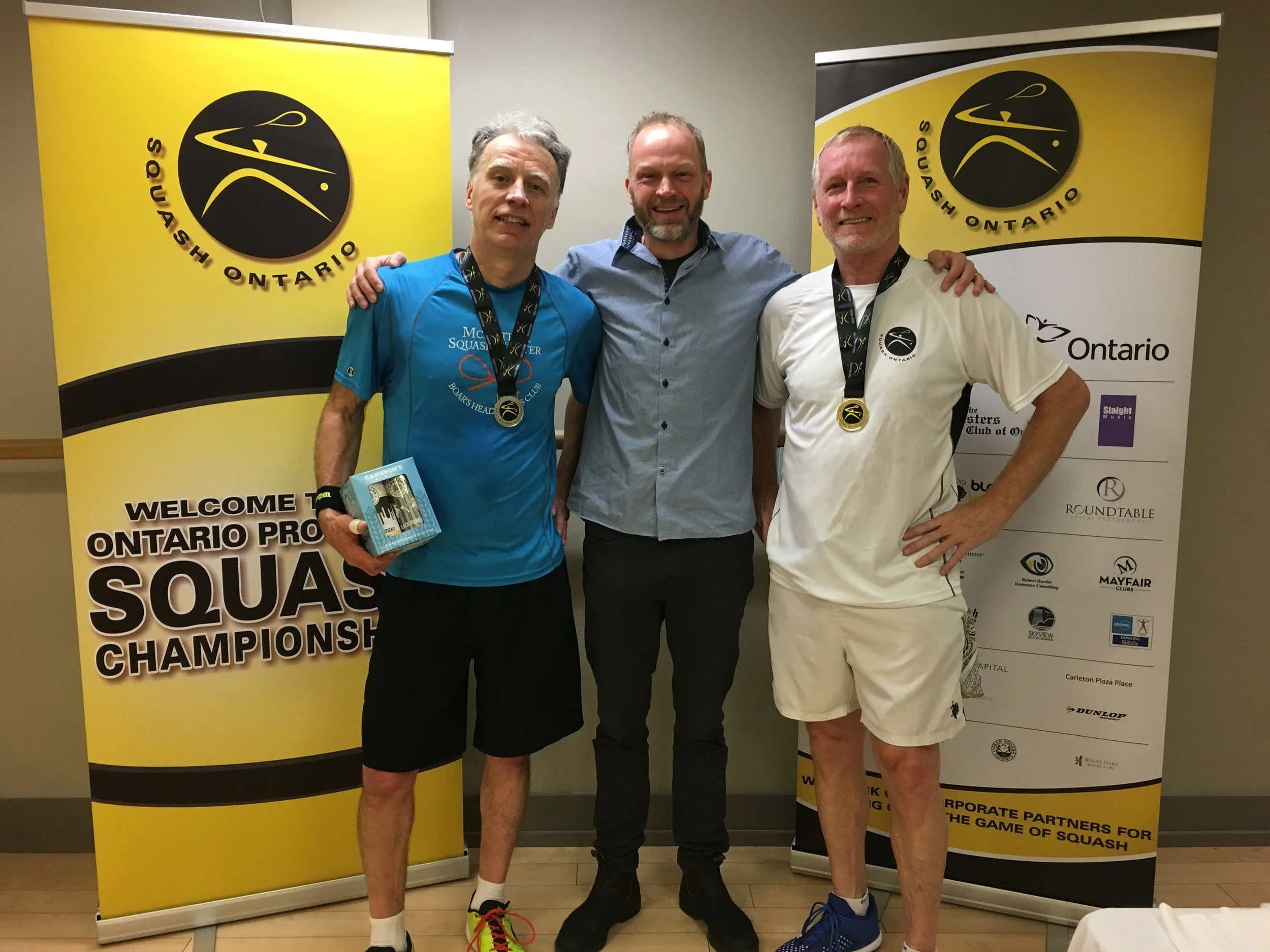 L-R: Wayne Weathehead, Squash Ontario's President Bruce Marrison, Guy Gordon