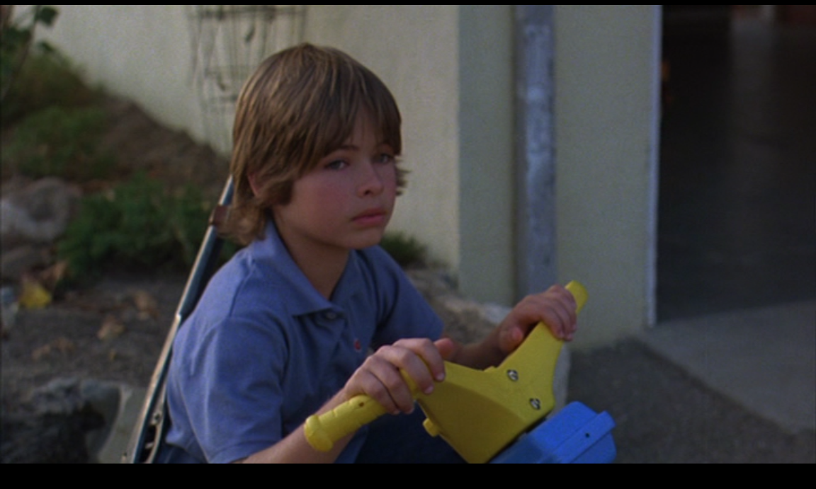 In the opening title sequence of Suburbia (Penelope Spheeris, New World Pictures, 1984), Ethan watches as his brother even leaves to face life on his own.