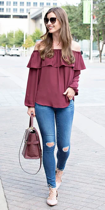 burgundy top with blue jeans