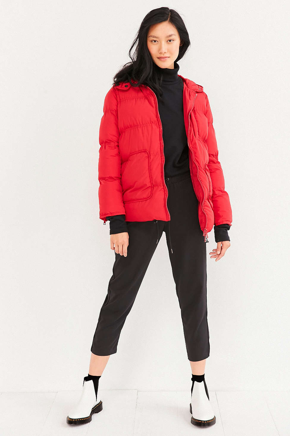 White Sweater, Red Puffer Jacket, Leggings, Black Sneakers, and