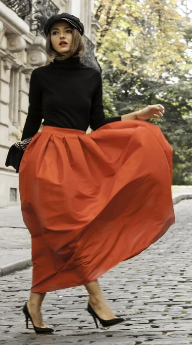 red long skirt and black top