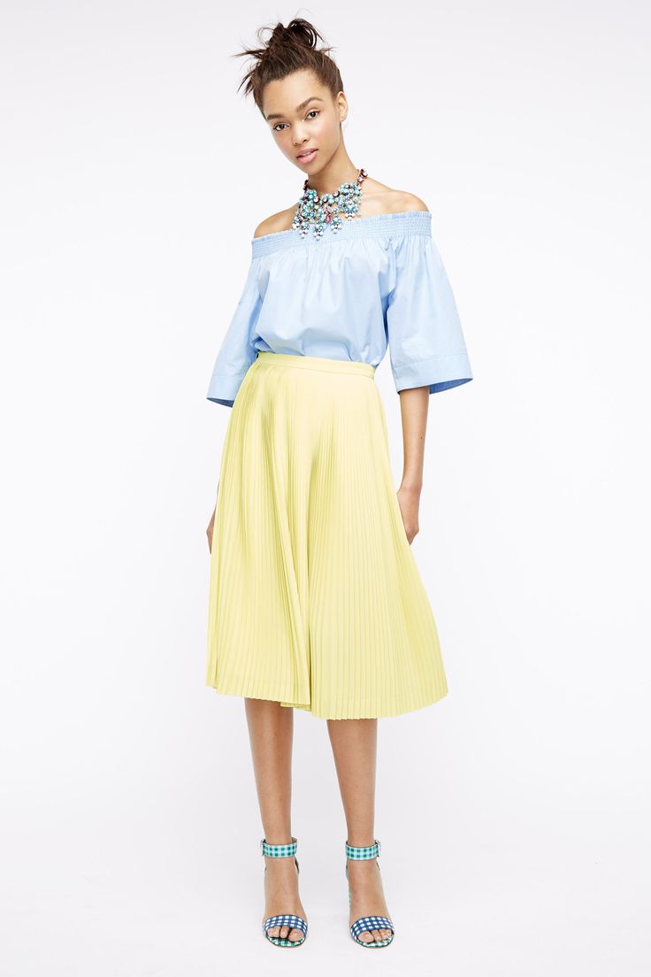 yellow top blue skirt