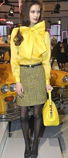 yellow top black skirt