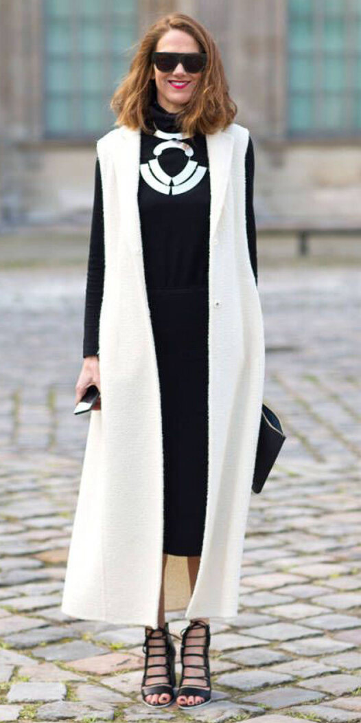 black-midi-skirt-black-sweater-turtleneck-bib-necklace-hairr-sun-black-shoe-sandalh-white-vest-knit-maxi-fall-winter-dinner.jpg