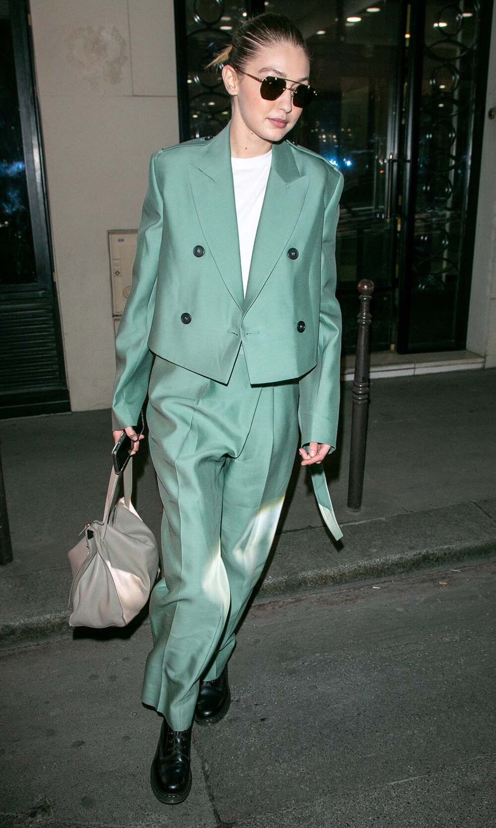 green-light-wideleg-pants-tan-bag-white-tee-green-light-jacket-blazer-suit-blonde-sun-bun-black-shoe-booties-gigihadid-fall-winter-lunch.jpg