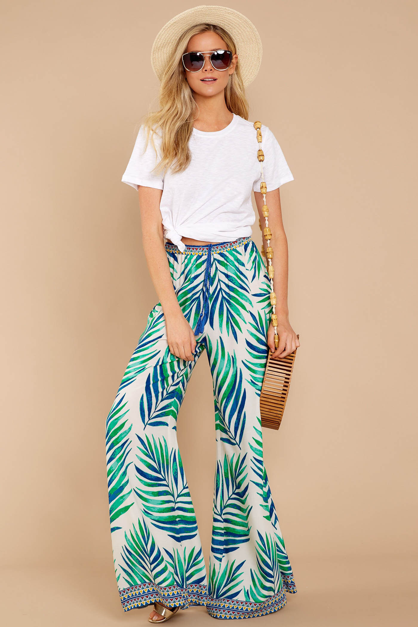 green-emerald-wideleg-pants-hawaiian-print-white-tee-tan-bag-hat-straw-sun-blonde-spring-summer-weekend.jpg