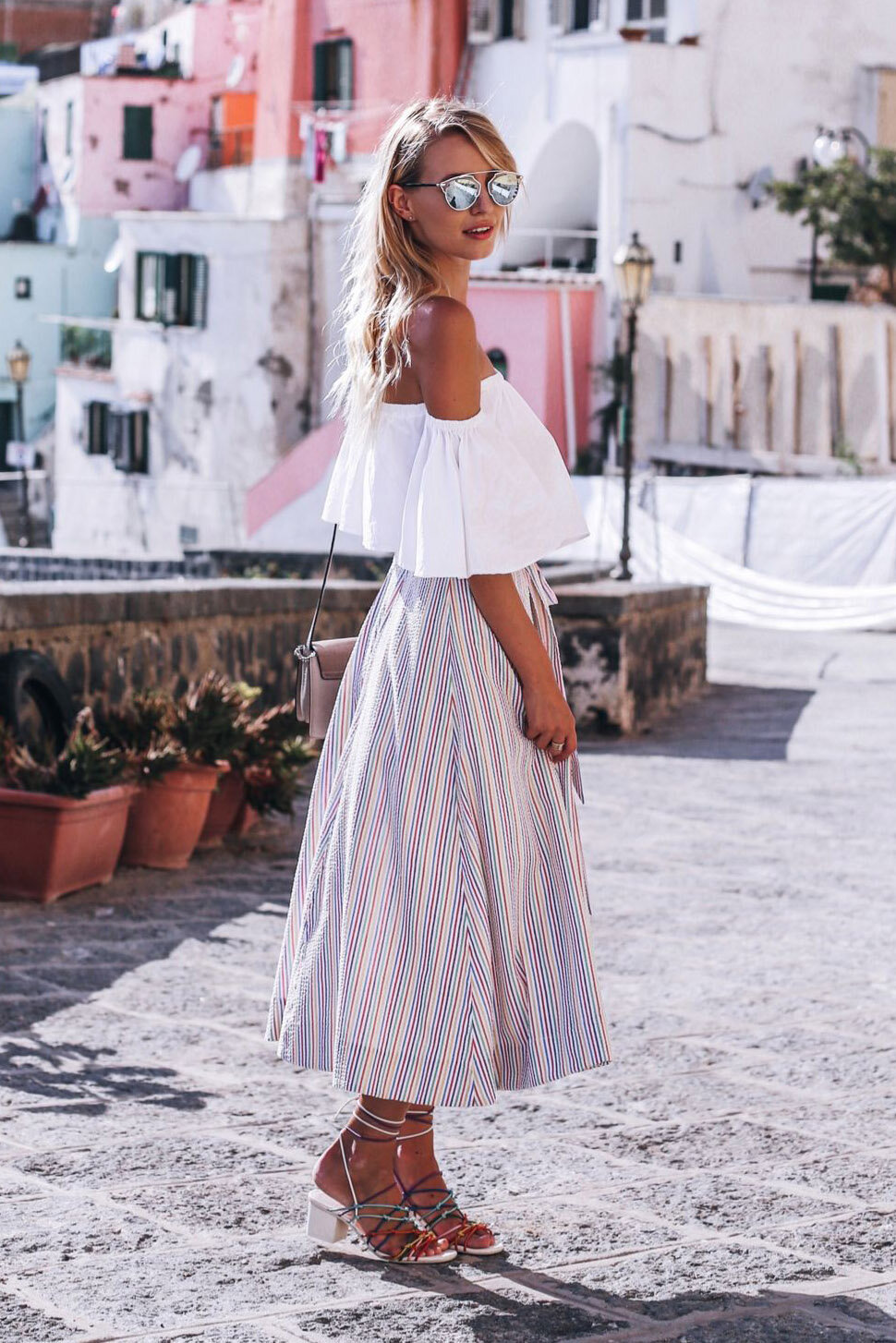 white-midi-skirt-vertical-stripe-white-top-offshoulder-blonde-sun-white-shoe-sandalh-spring-summer-italy-lunch.jpg