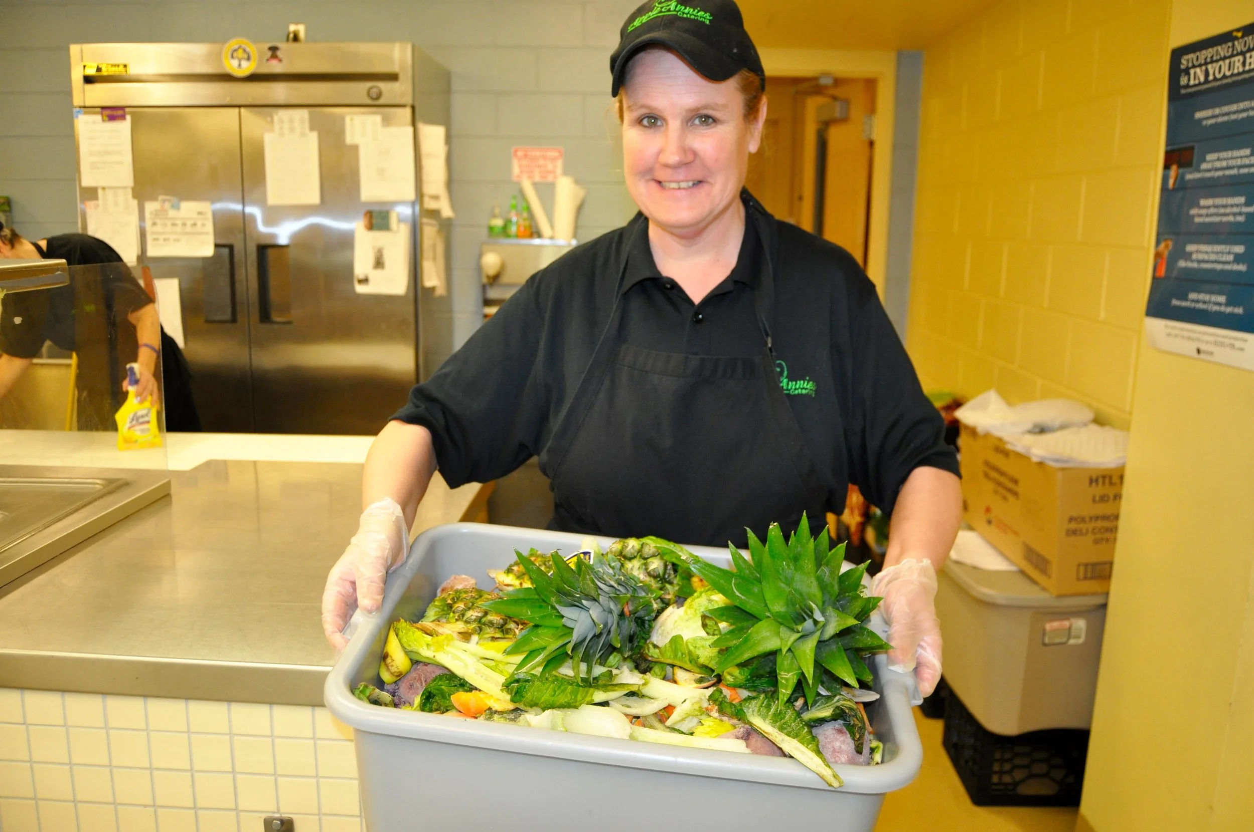 Annie Bercaw of Apple Annie's Catering shows the food waste scraps that can be composted.