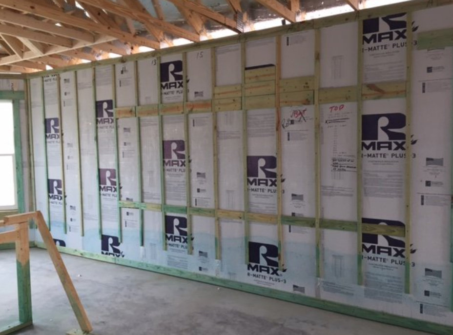 Interior wall insulation installed between studs, showing high R-Value for energy efficiency.