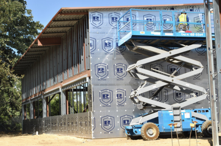 Exterior insulation installation on commercial building, showing common insulation mistakes.