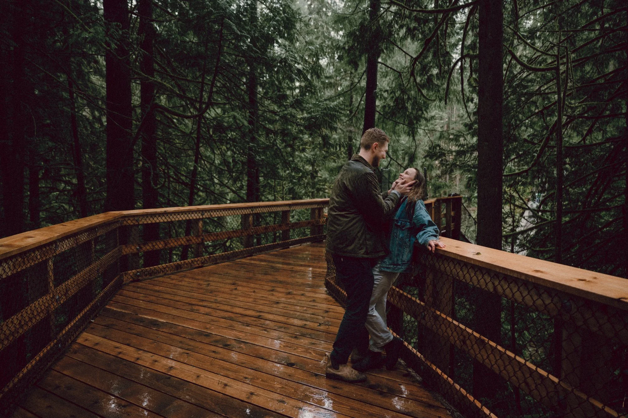 Editorial portrait of a couple embracing in the rain during their engagement session in North Vancouver