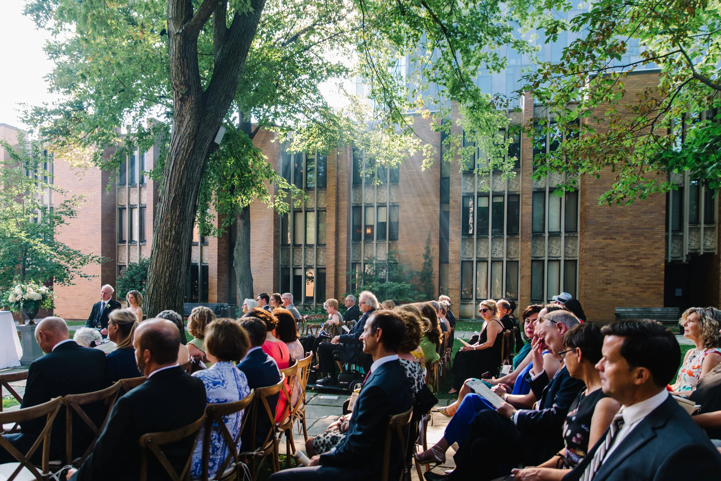 Wedding guests watching ceremony at Massey College University of Toronto