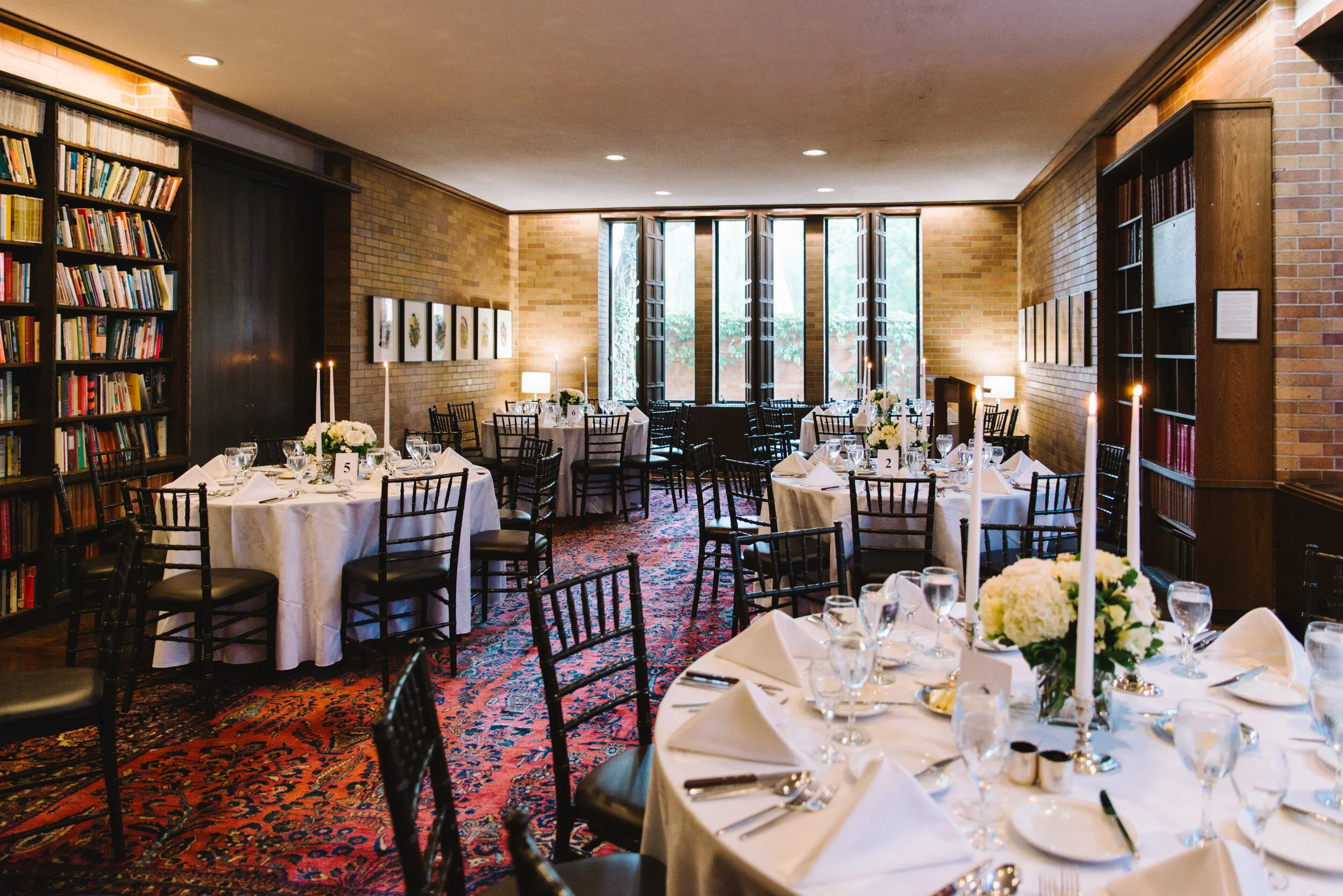 Wedding dinner set up in the Massey College library University of Toronto