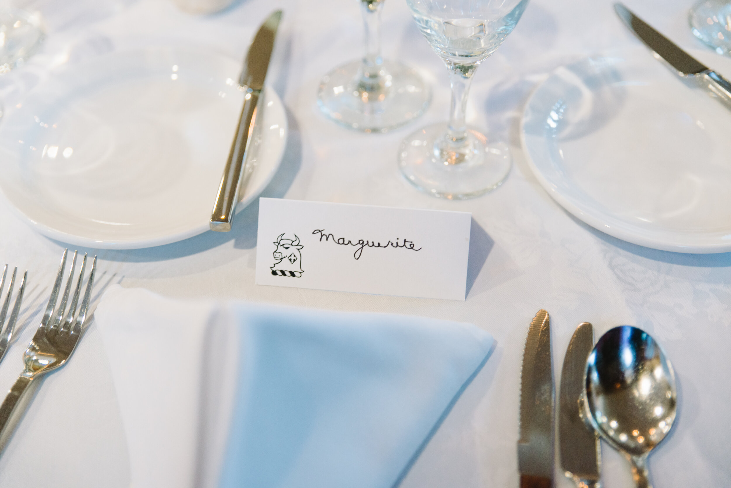 Handwritten place setting detail at intimate Massey College Toronto wedding