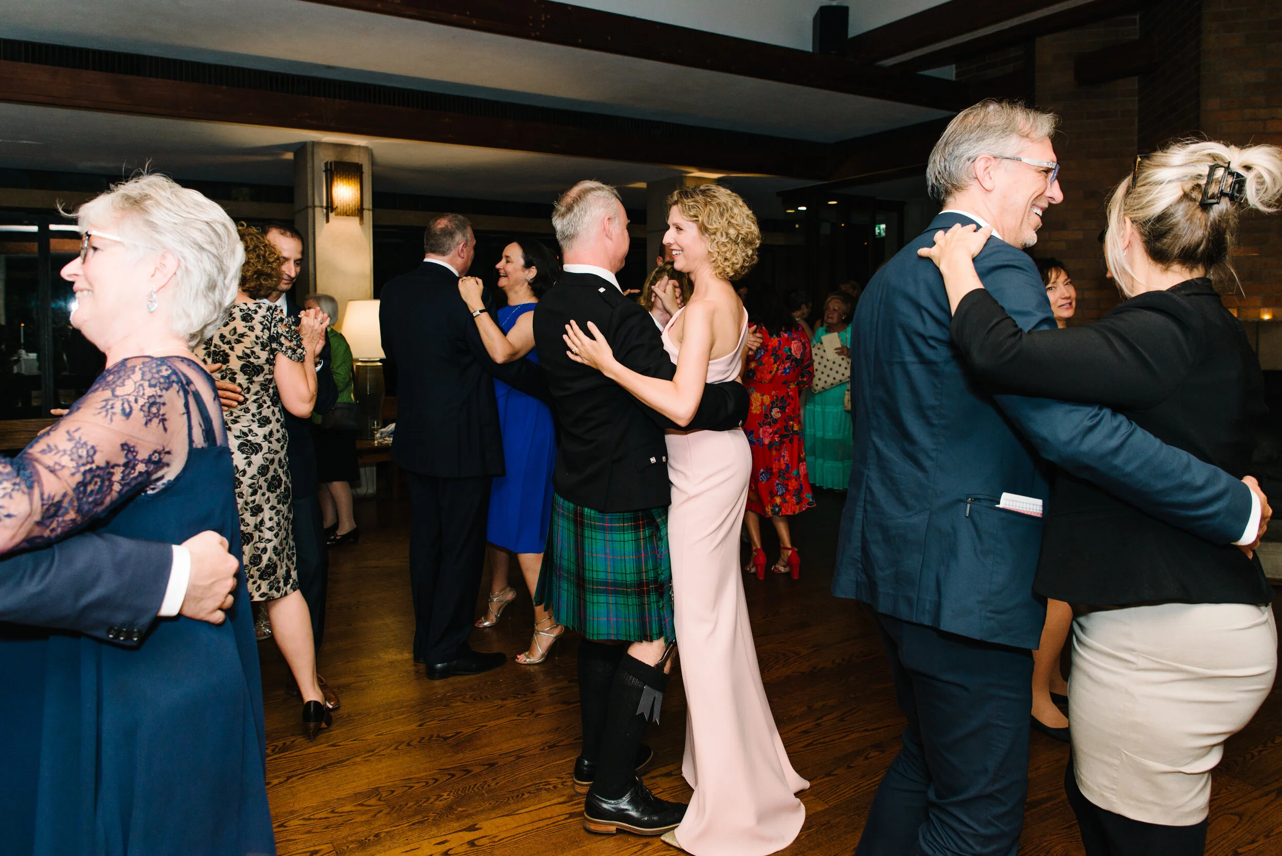 Bride and groom sharing spontaneous first dance at Massey College Toronto wedding