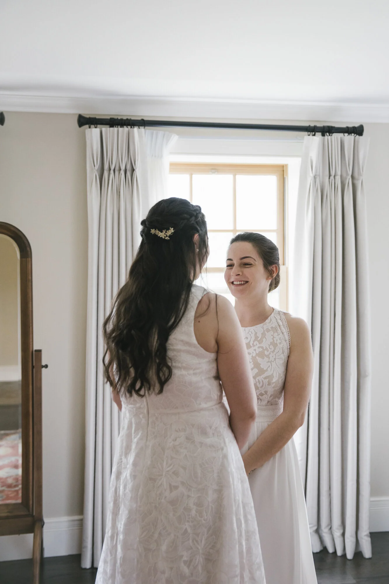 Romantic first look between bride and bride at the Ancaster Mill in Hamilton, ON.