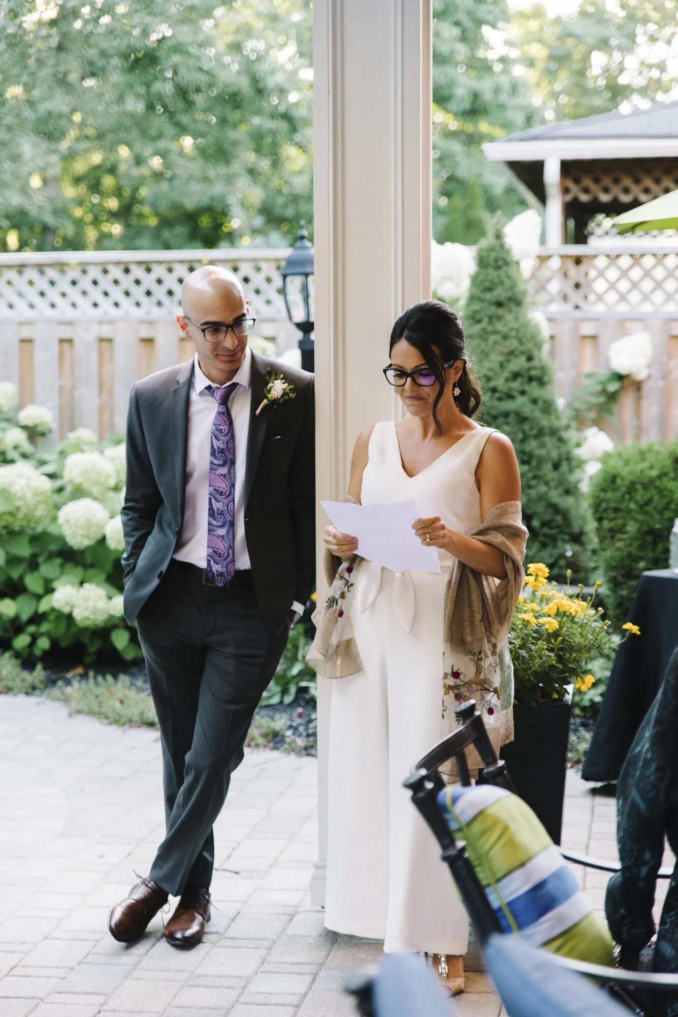 Emotional candid of a guest delivering a speech during a backyard wedding dinner in Mississauga