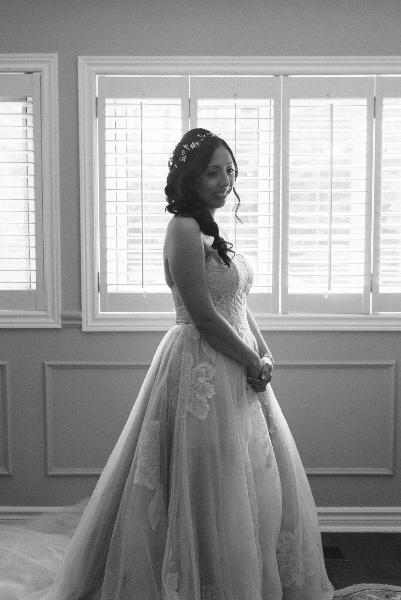 Black and white editorial inspired portrait of a bride wearing a Watters wedding dress from The Modern Bride during an intimate backyard wedding