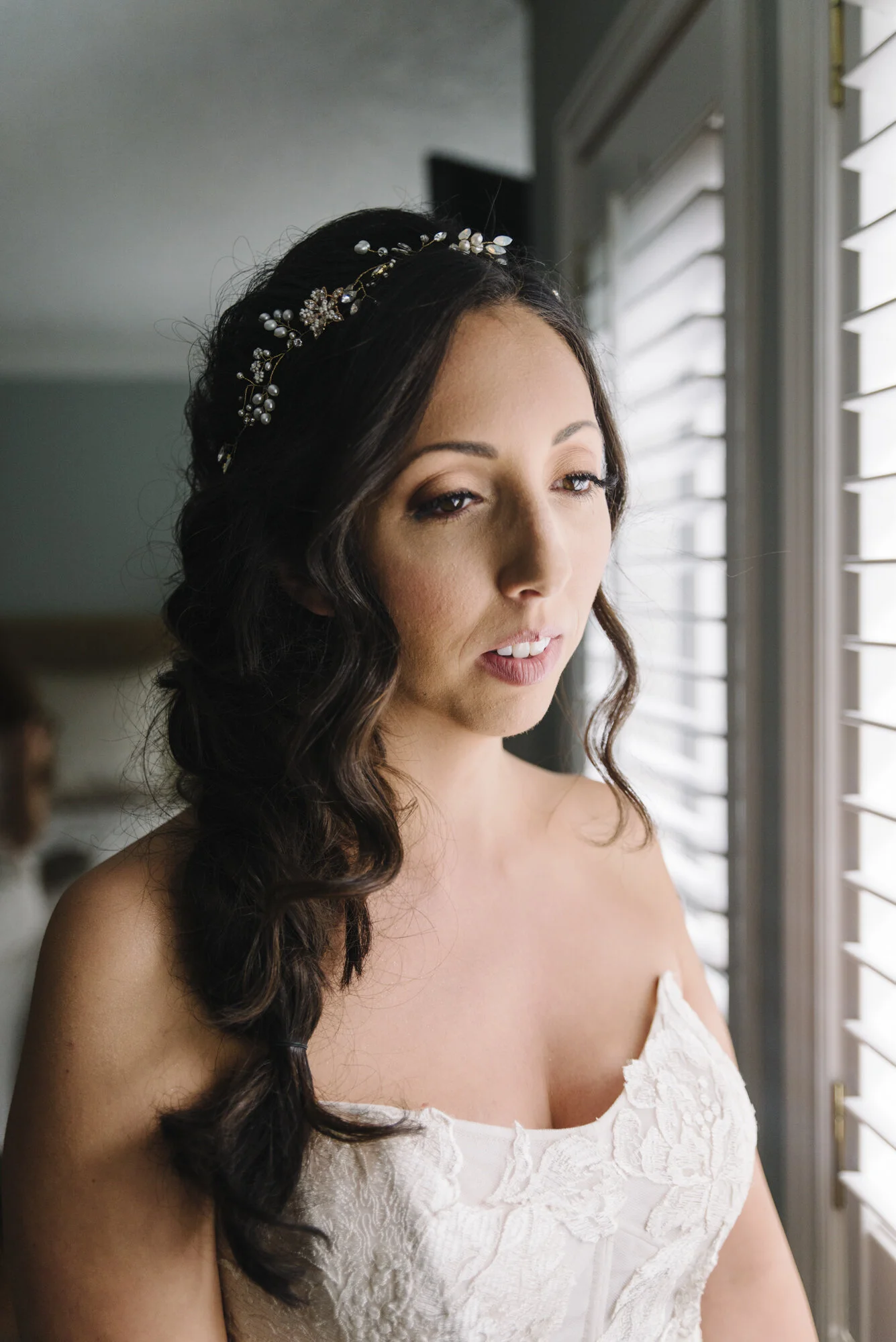 Close up portrait of a bride with hair by Brittany Silla and makeup by Beyond the Skin Beauty at an intimate backyard wedding
