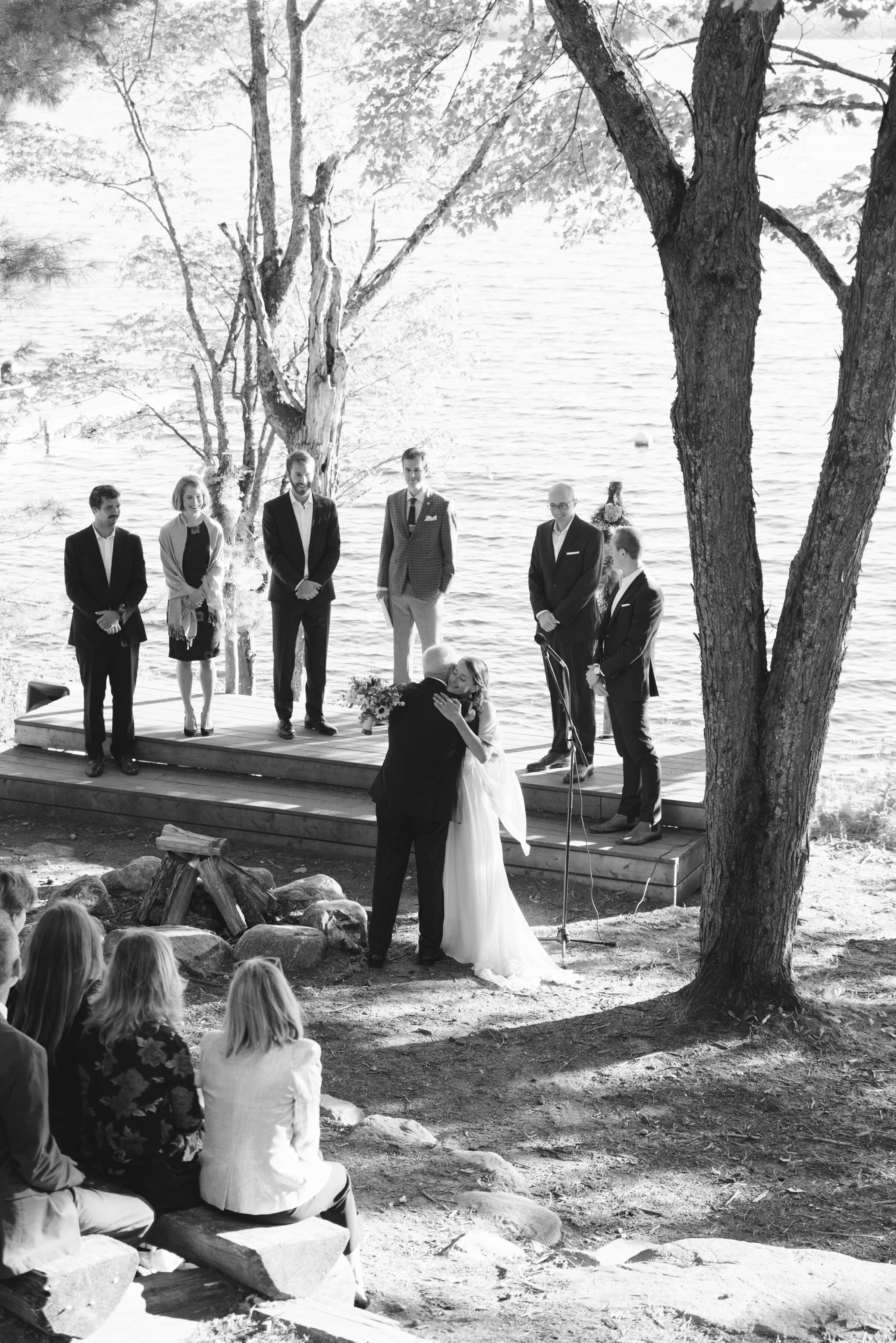 Black and white candid photography during wedding ceremony at Camp Manitou in Parry Sound, Ontario