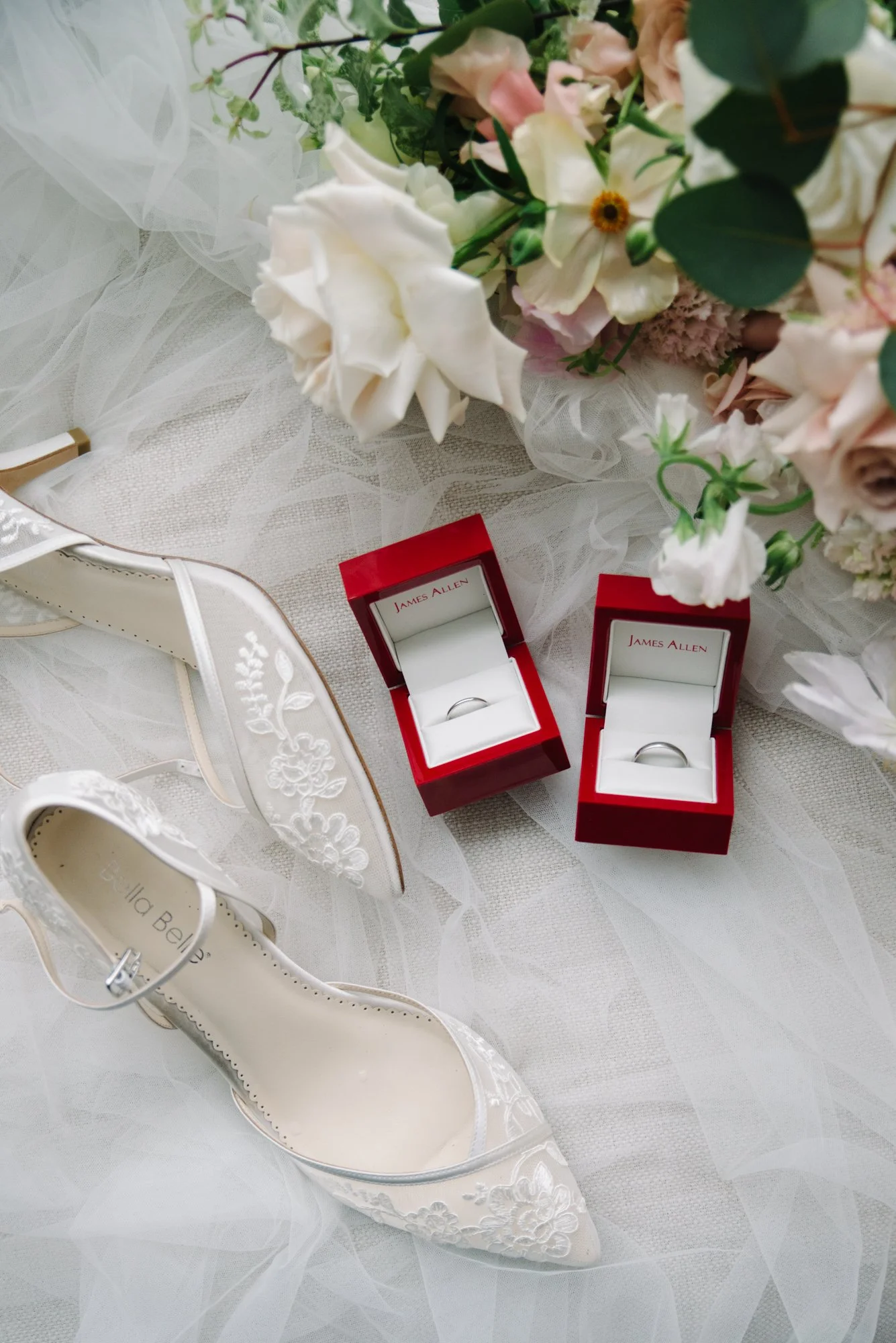 Editorial styled wedding details; wedding shoes, rings, and flower bouquet at One Hotel Toronto
