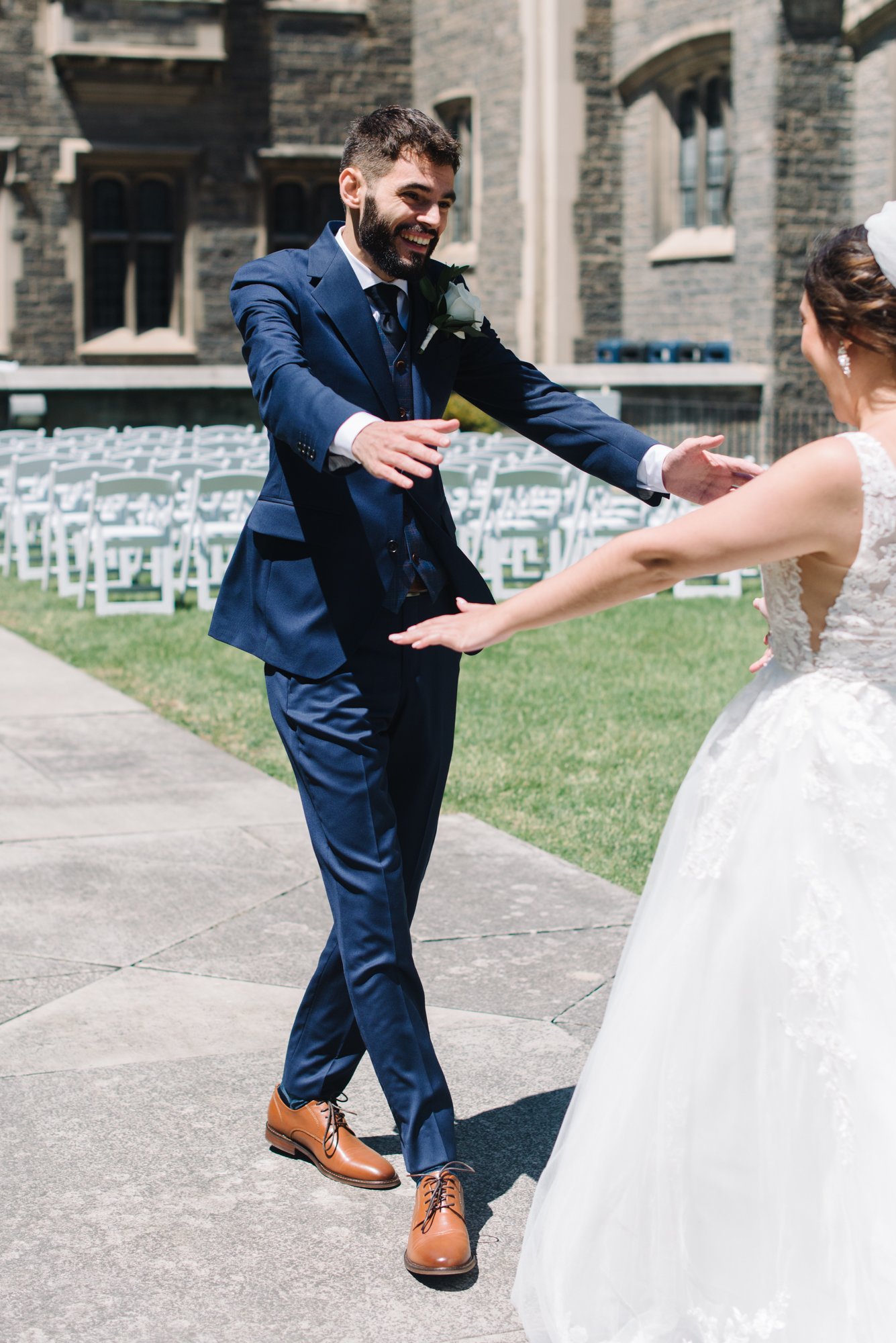 A tender and emotional first look between a bride and groom at Hart House, University of Toronto