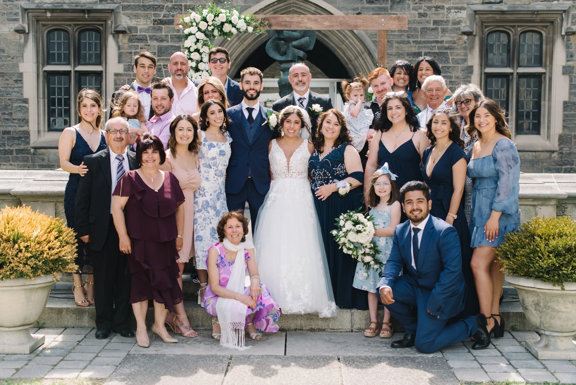 Group photo of wedding at the University of Toronto's Hart House