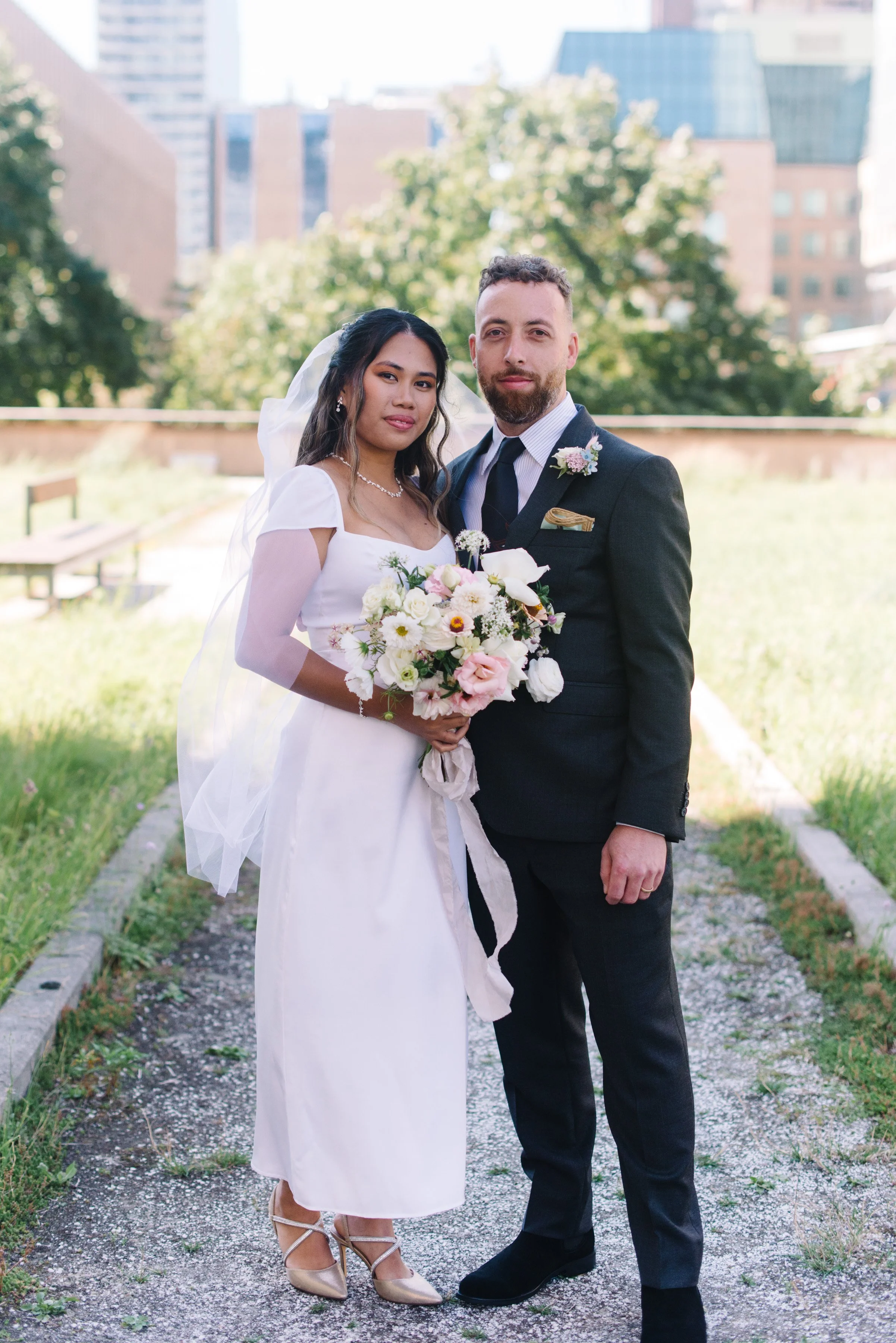 Timeless portrait of a bride and groom on their elopement day at Toronto City Hall