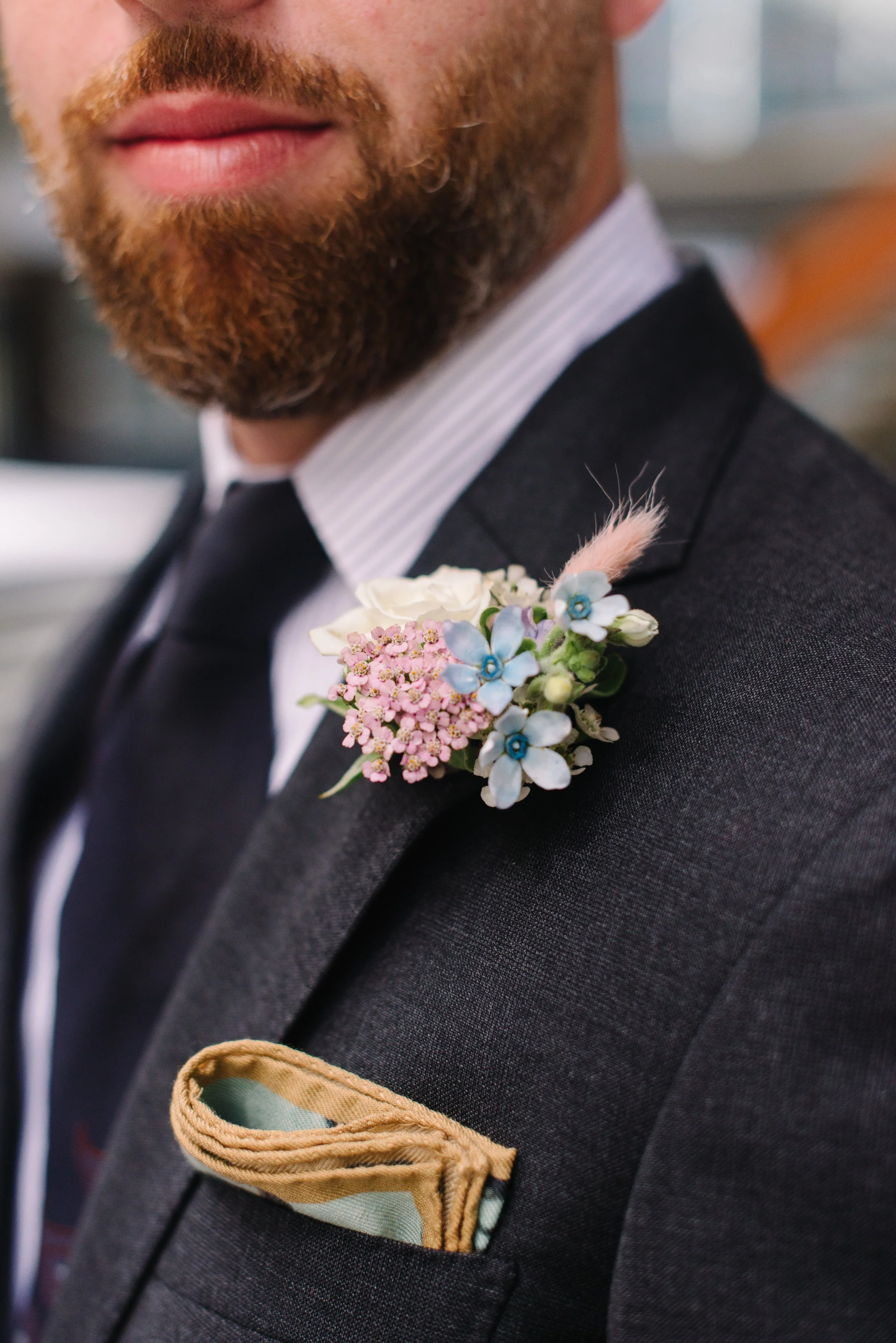 Detail photo of a groom's boutonnière on his elopement day in Toronto