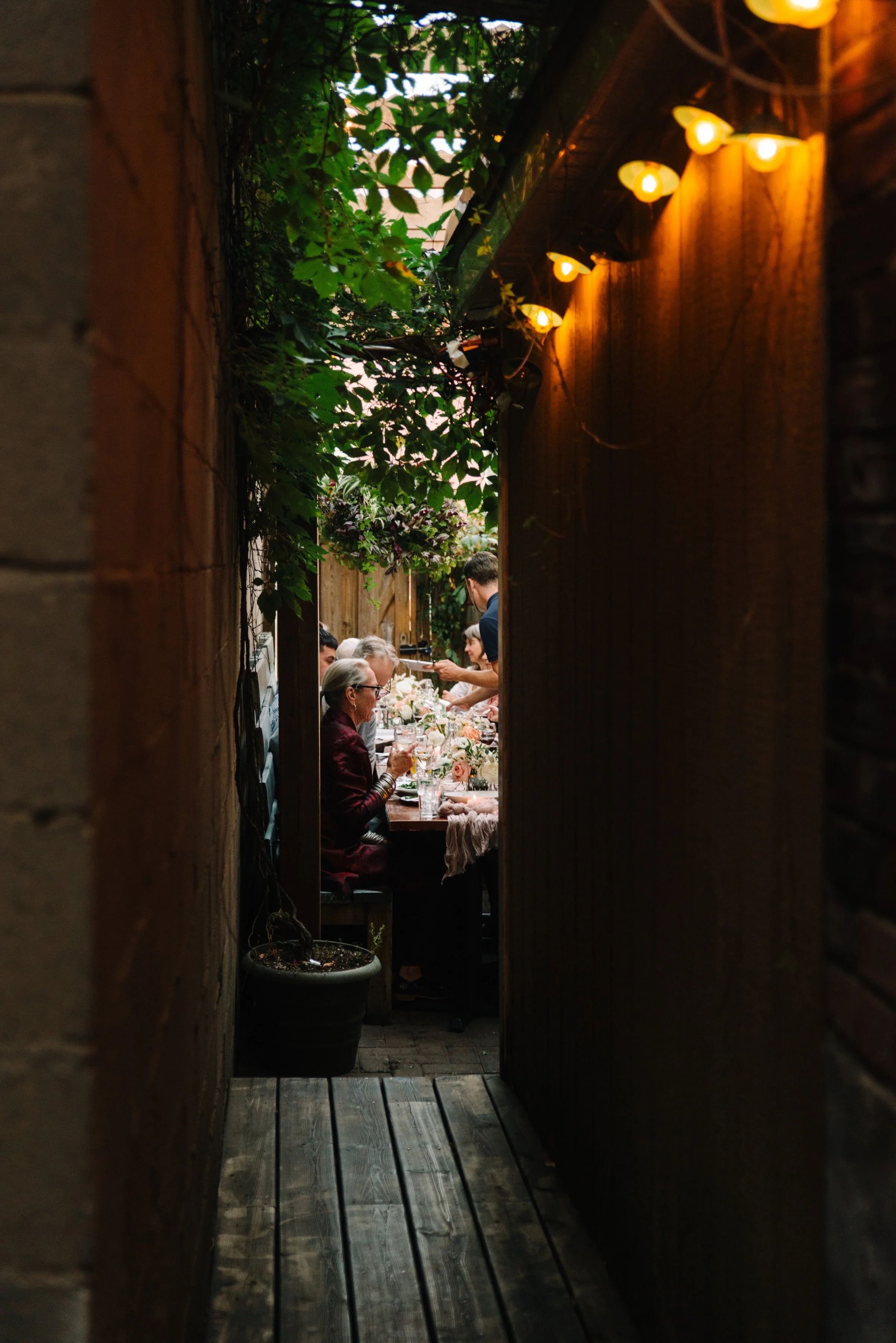 Photo of the back patio reception space at Foxley Bistro in Toronto taken from the walkway leading to the space