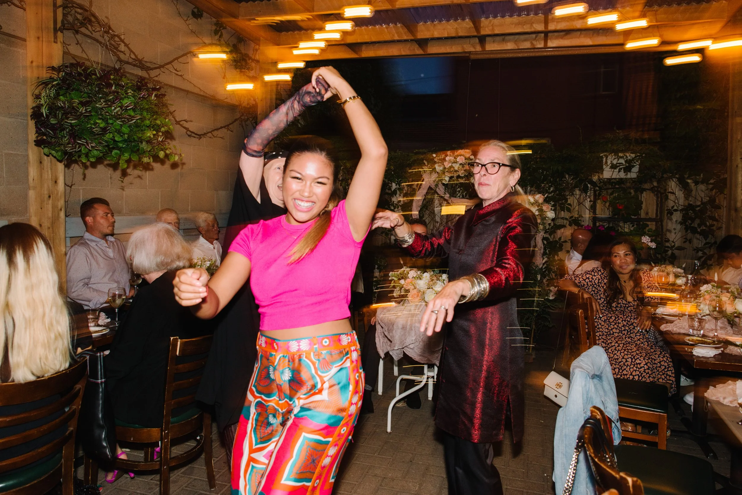 Candid photo of guests dancing and celebrating during the reception at Foxley Bistro in Toronto