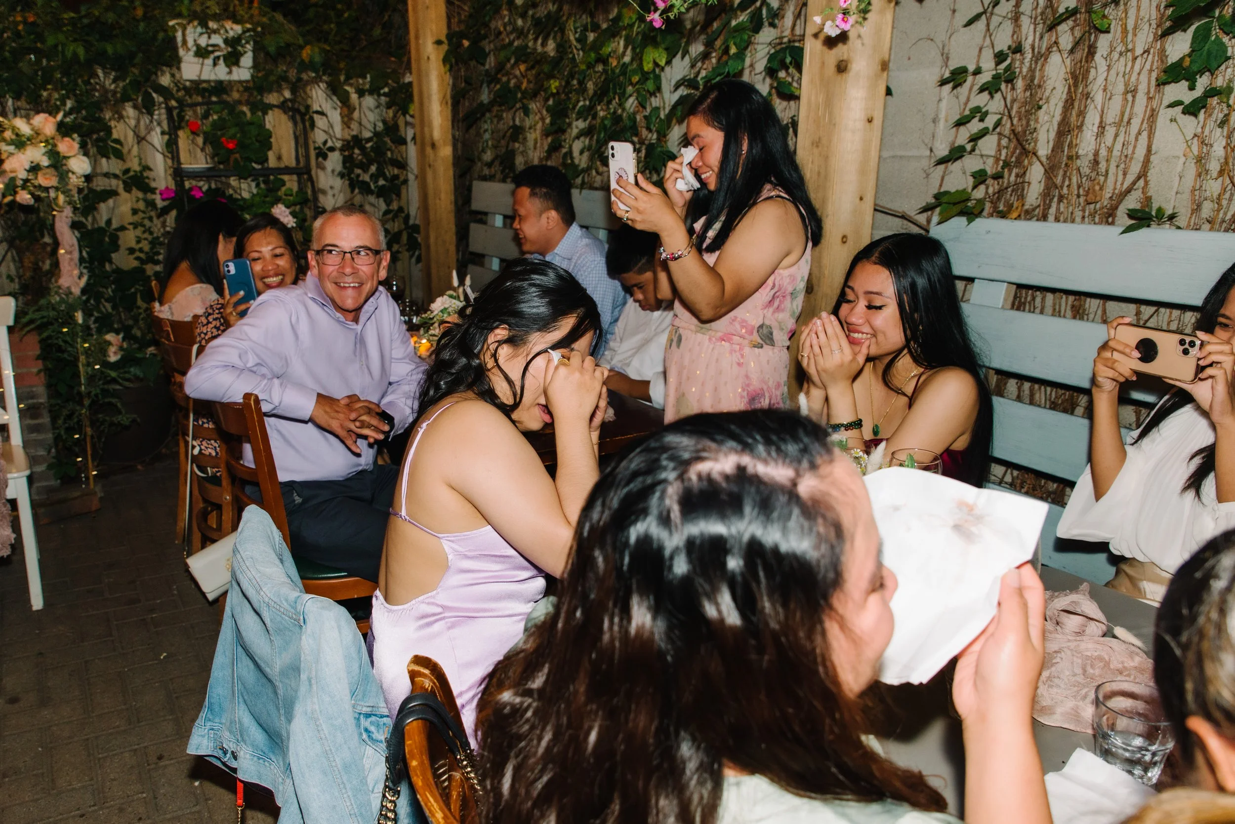 Candid photo of guests getting emotional and crying during an intimate elopement reception at Foxley Bistro, Toronto