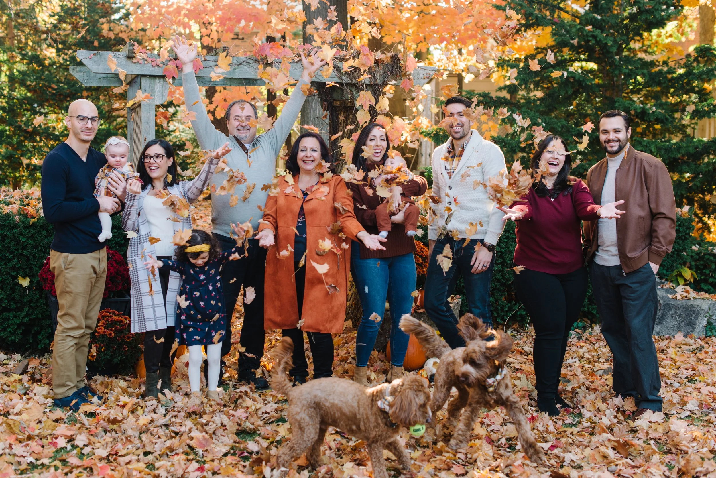 Candid multi-generational family photo taken during a fall session in the GTA