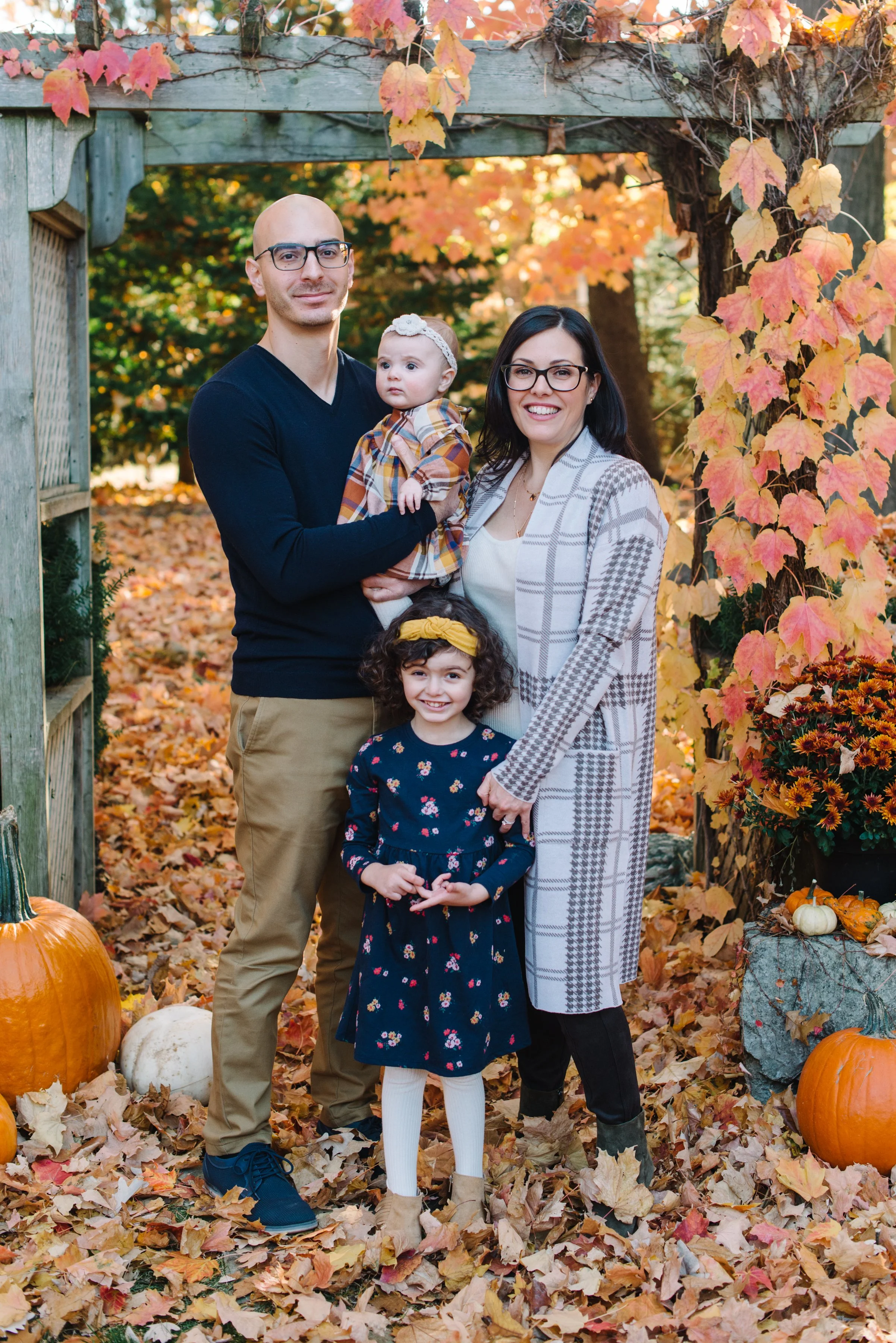 Family portrait taken in a private backyard during a fall family photography session near Toronto