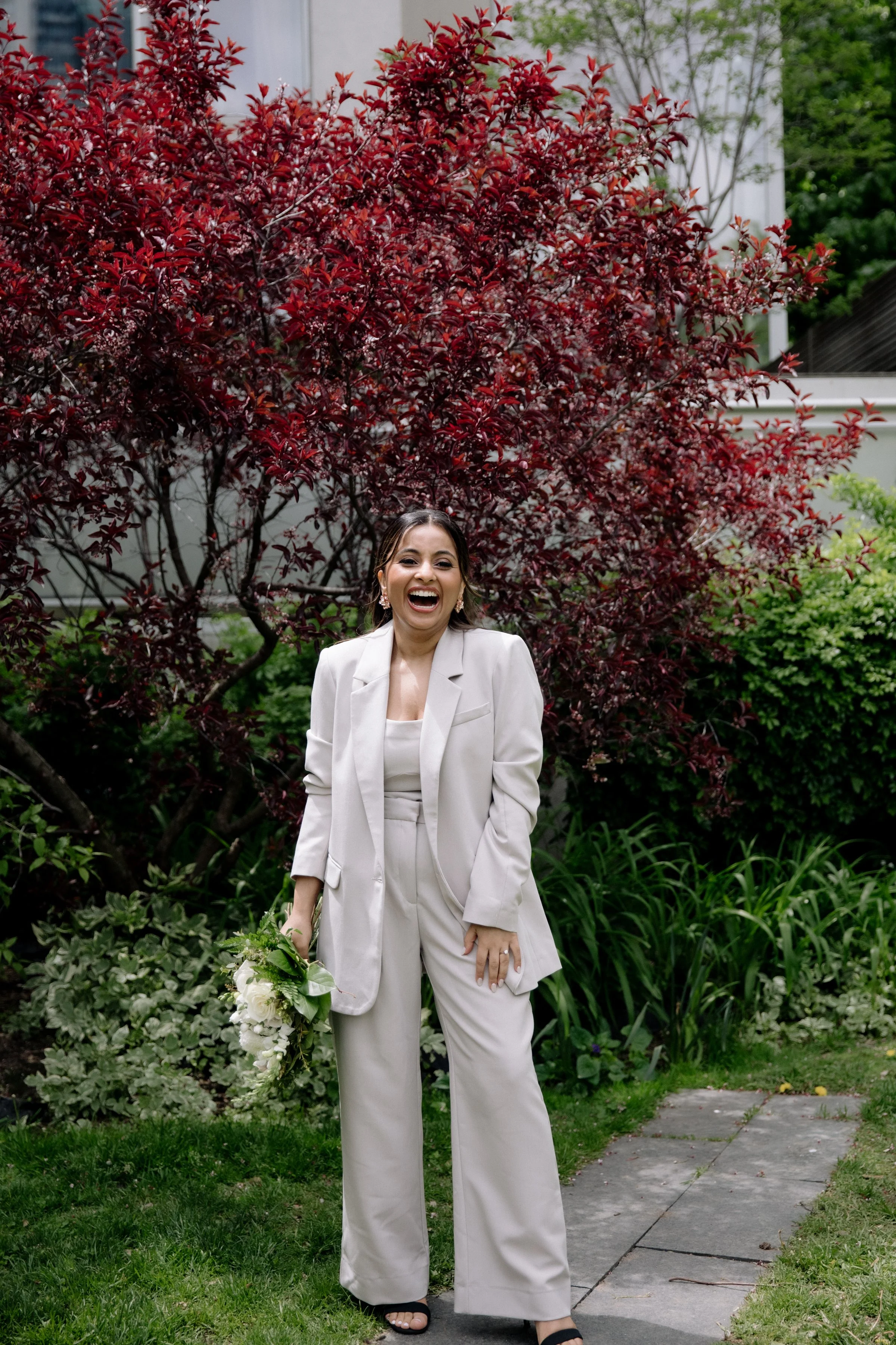 Chic solo portrait of a bride before her same-sex elopement at Toronto City Hall
