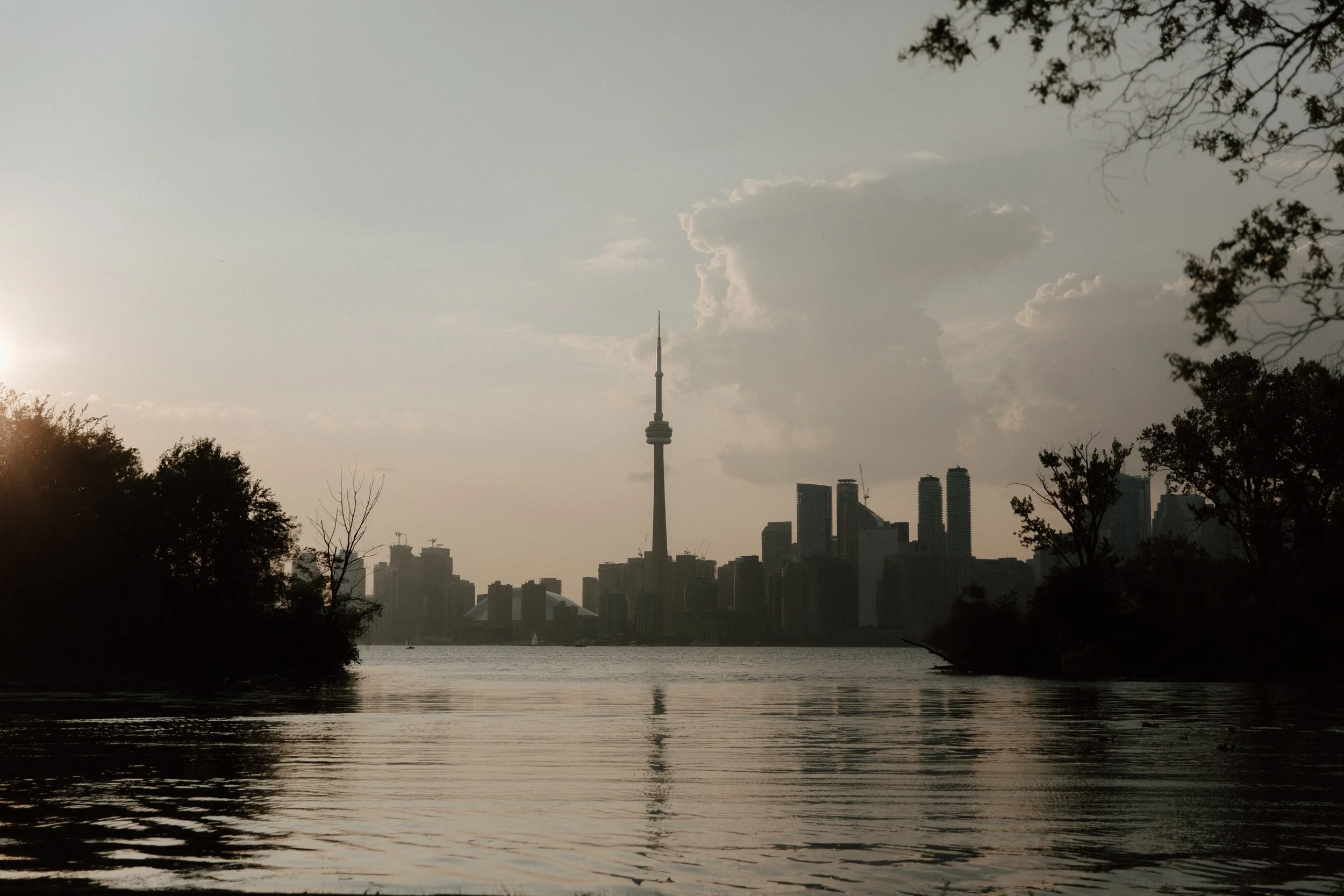 Golden hour Toronto skyline at sunset viewed from Centre Island across Lake Ontario