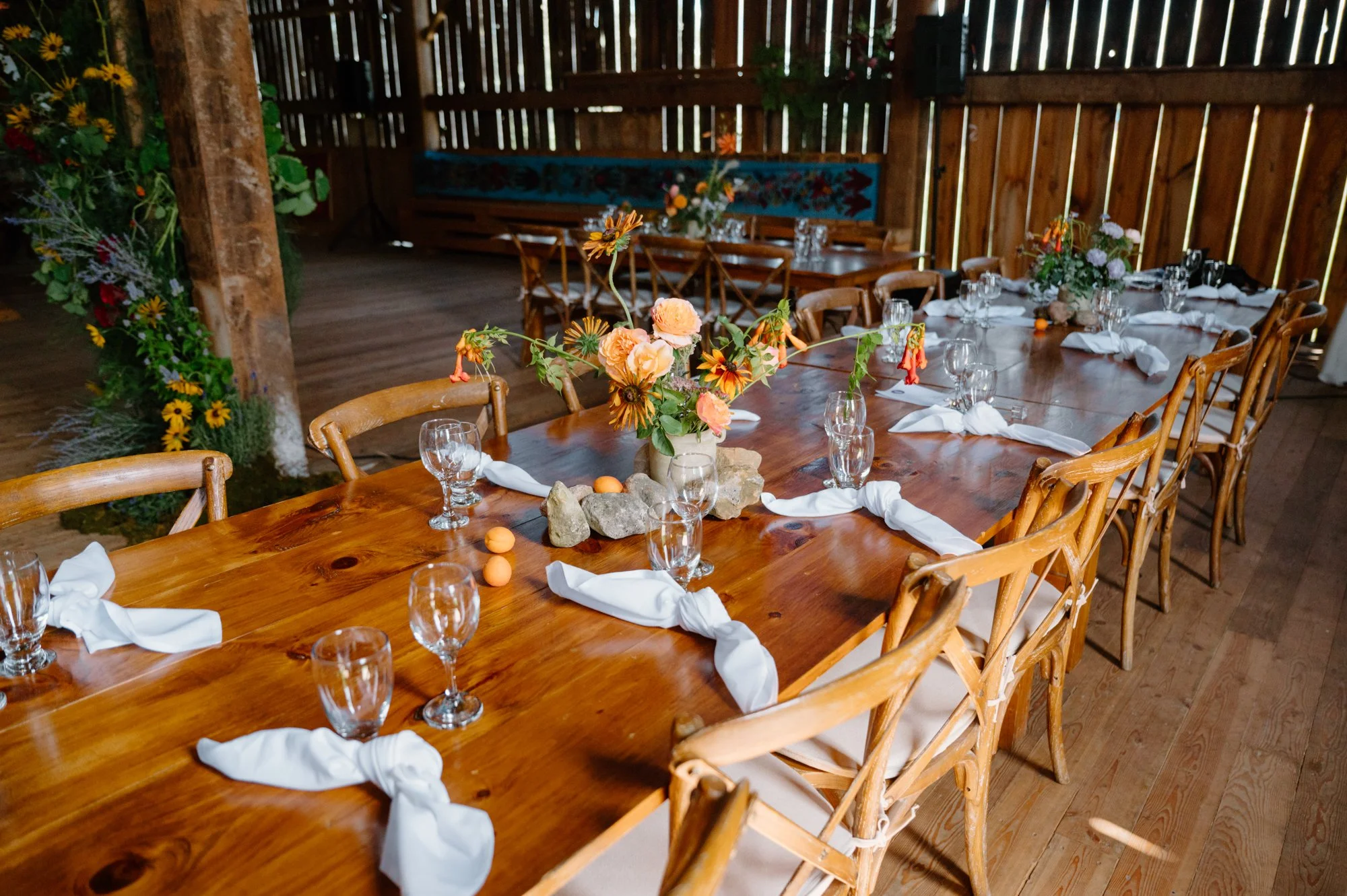 Documentary style photo of a reception table at a rustic barn wedding near Orangeville, Ontario
