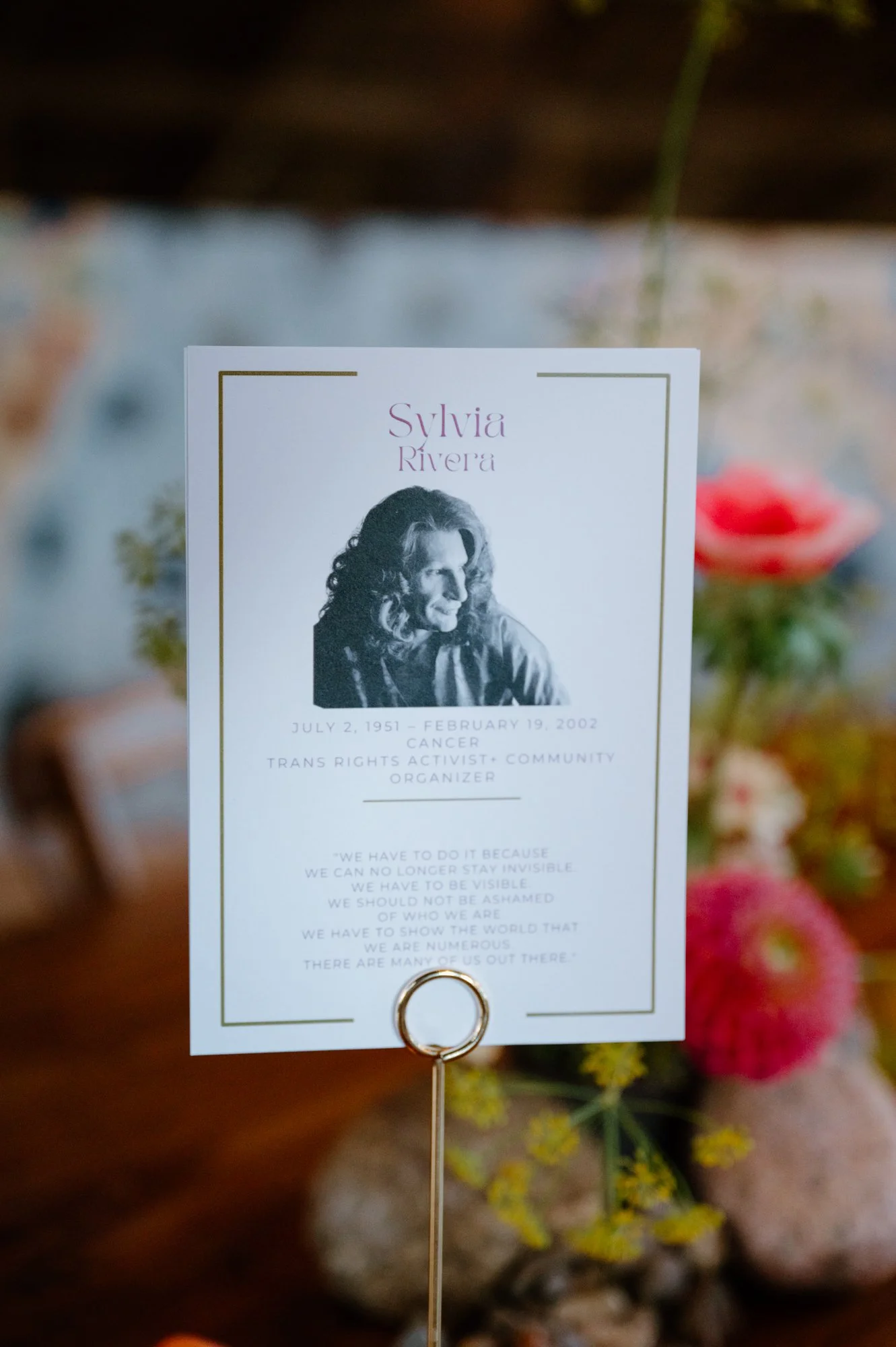 Wedding table setting featuring trans activist Sylvia Rivera at a queer wedding near Orangeville, Ontario