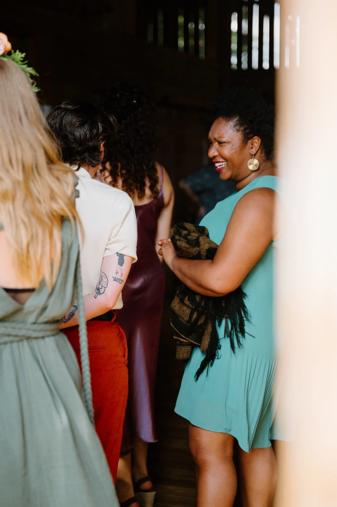 Candid documentary photo of guests at an LGBTQ+ farm wedding near Orangeville, Ontario