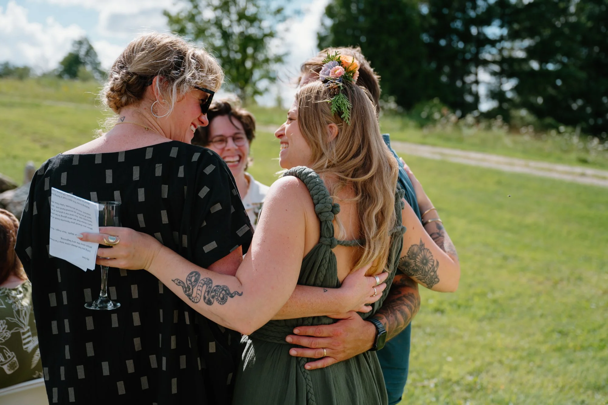Documentary style candid of guests at an intimate queer wedding near Orangeville, Ontario