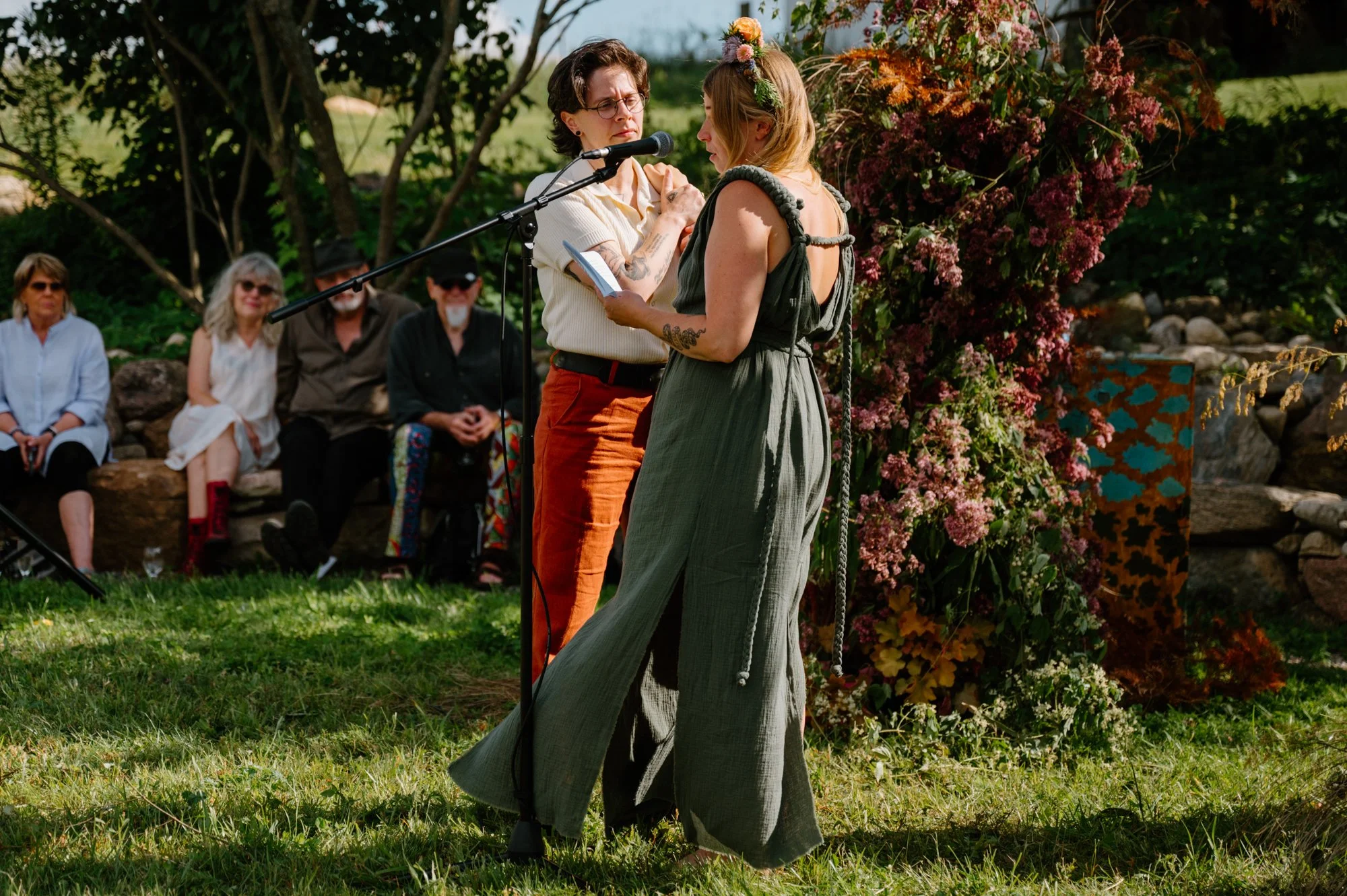 Emotional candid of a queer couple during their wedding ceremony at a farm near Orangeville, Ontario