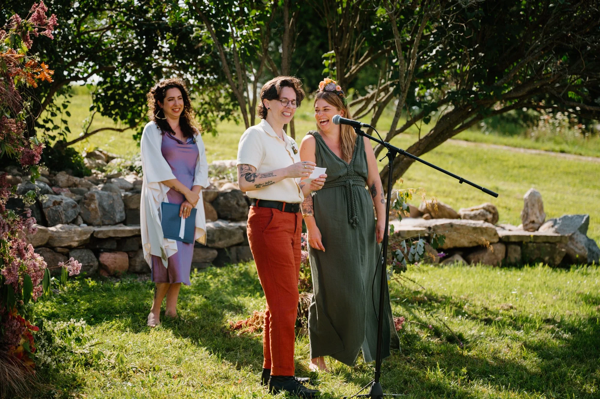 Queer couple sharing words during their wedding ceremony at a rustic farm near Orangeville, Ontario
