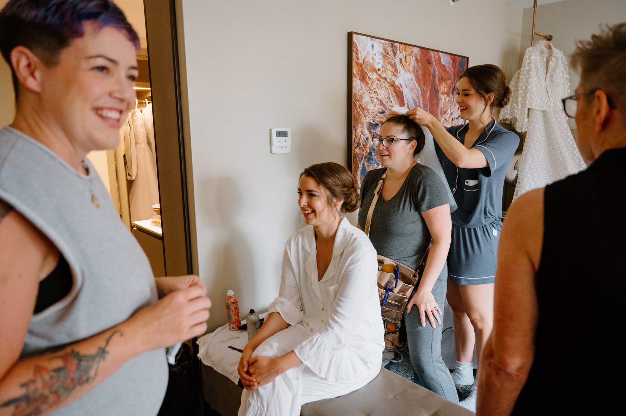 Bride getting ready in natural light before her AGO wedding in Toronto
