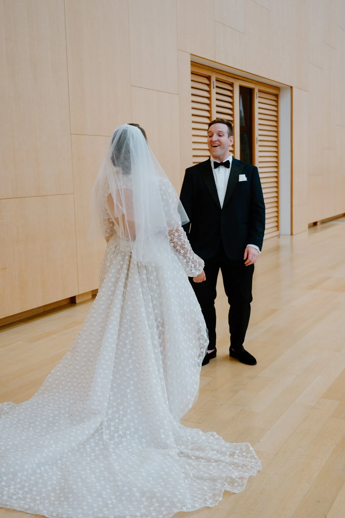 A bride and groom share their wedding day first look together at their Art Gallery of Ontario wedding