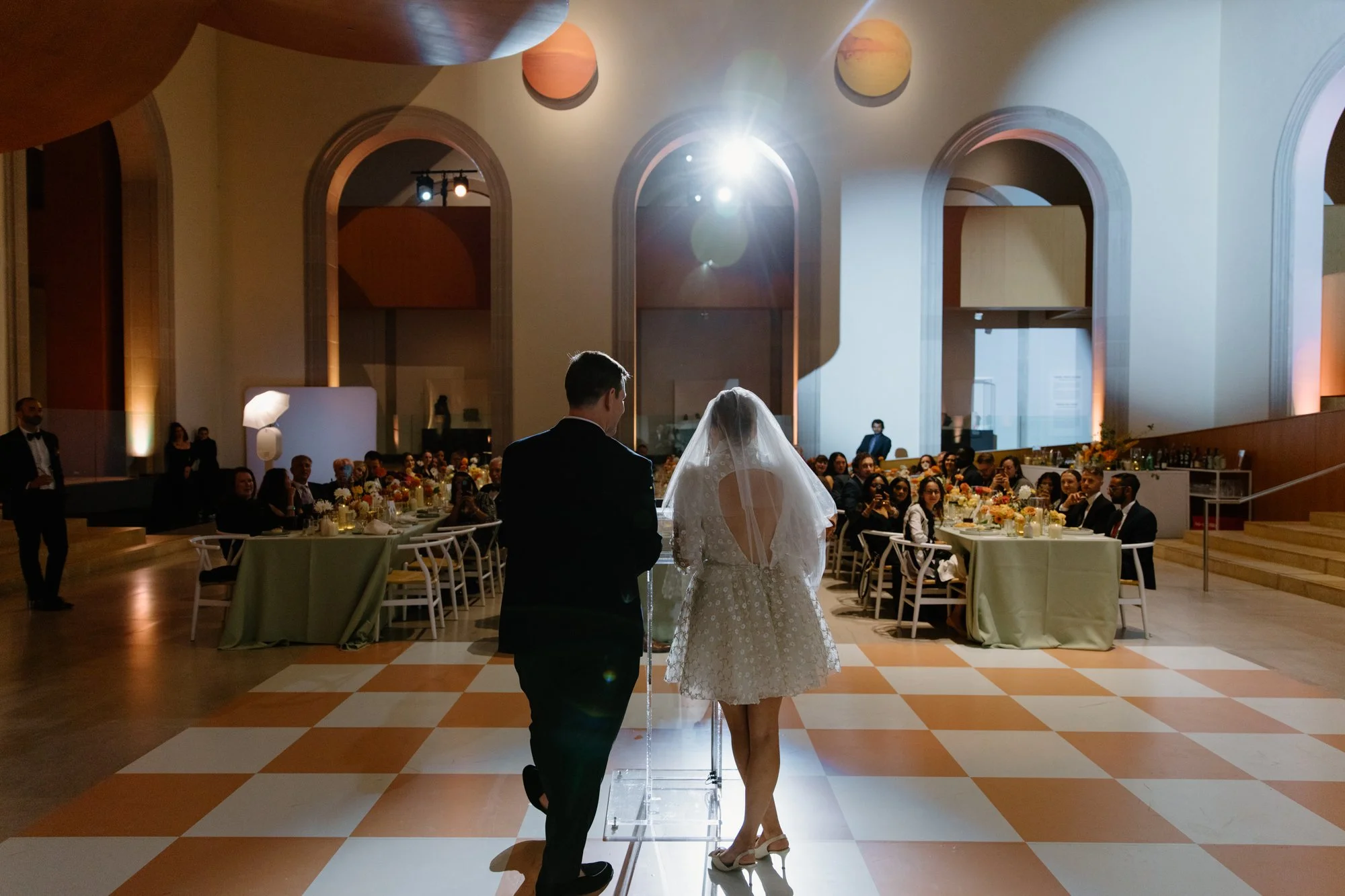 Editorial candid photo of the couple at their AGO reception