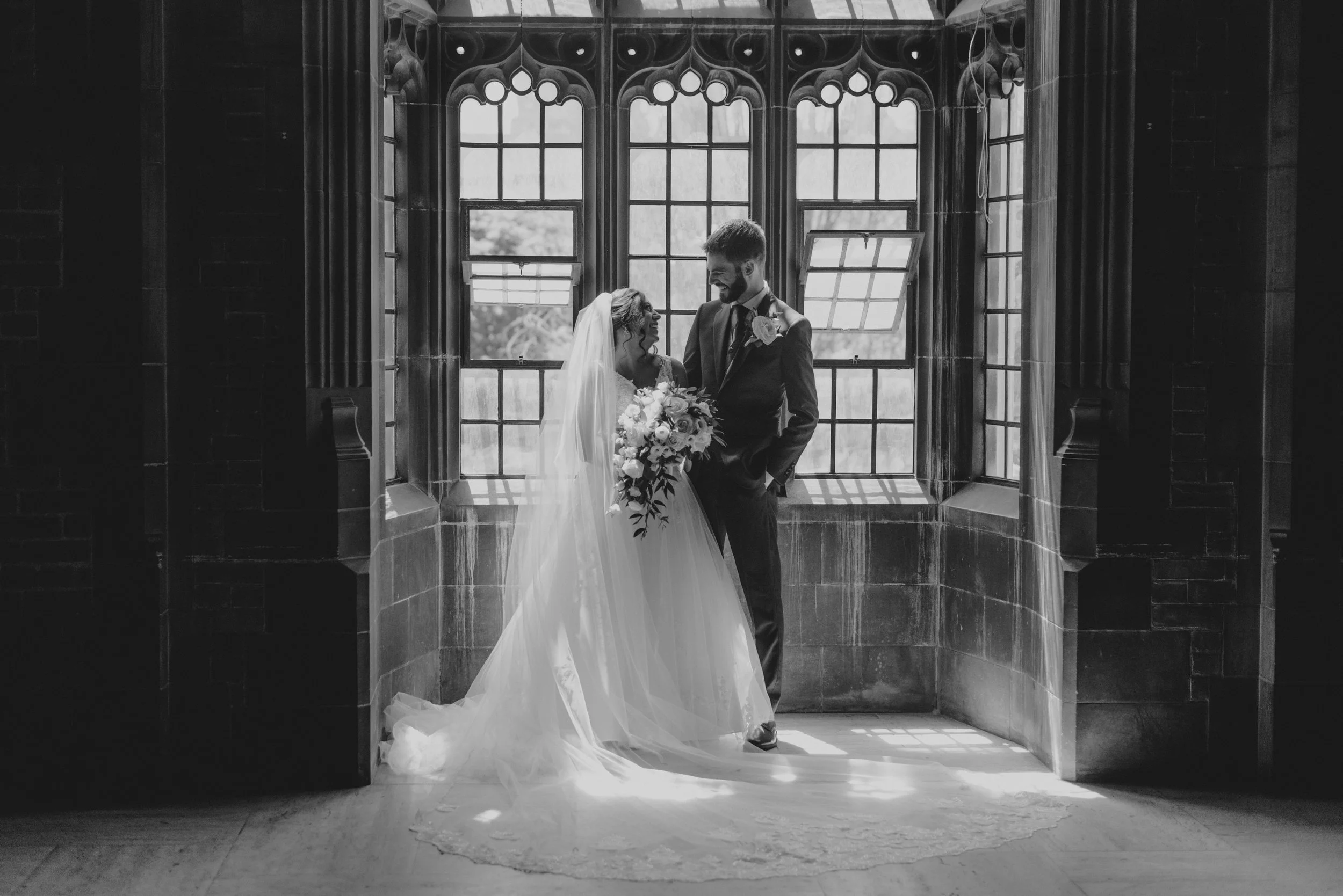 Black and white editorial bridal portrait taken at Hart House at the University of Toronto